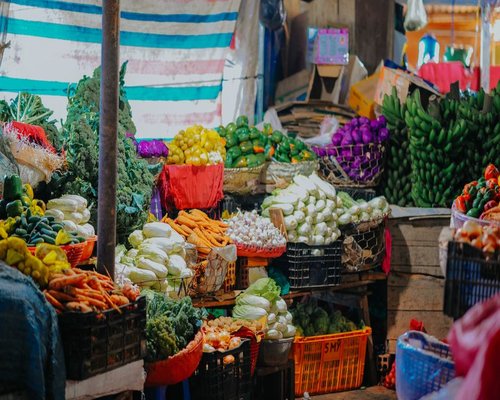 A colorful display of fresh fruits and vegetables at a local Colombian market